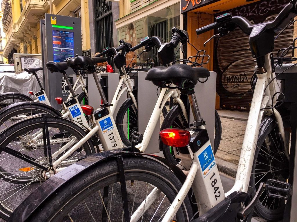 BiciMAD Madrid how to use step by step app MPass unlock dock ride return properly 2026