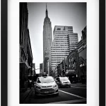 Lost in the maze of NYC streets. This black and white photo creates a feeling of mystery and intrigue, with the Empire State Building a distant beacon. #NYCNight #BlackAndWhiteVibes #NYC_ 1920