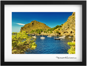 Mallorca coastline beauty on display! Sun, sand, and a sailboats sailing the turquoise waters 300