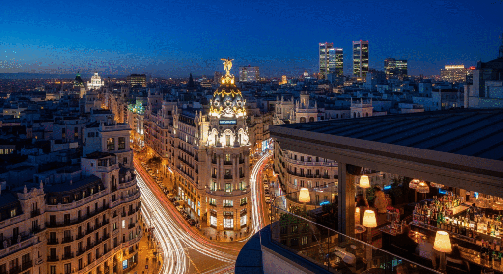 Madrid city lights night skyline view from rooftop bar terrace illuminated buildings