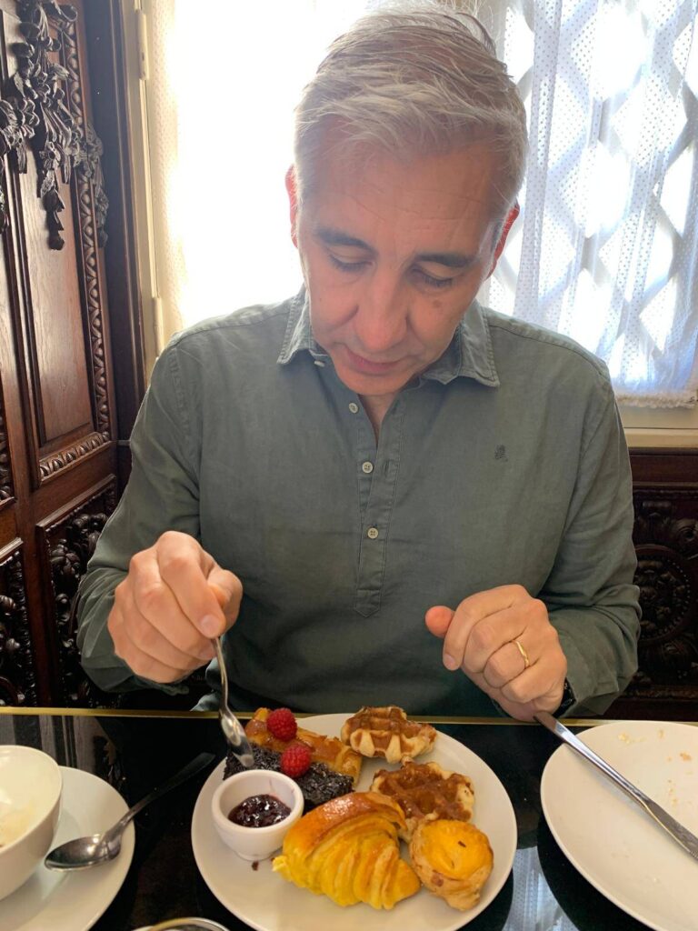 Jaime, creator of Madrid All Included, enjoying traditional pastries in Madrid.